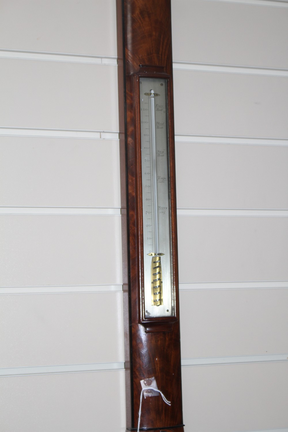A Regency mahogany and ebonised bowfront stick barometer by Bate of London, with silvered scale and thermometer, 97cm